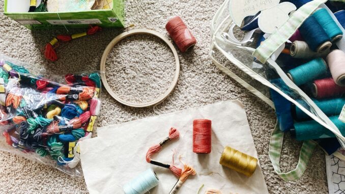 white and green plastic clothes hanger
